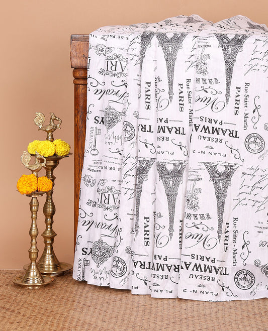 Borderless white vintage Paris-theme printed jute linen saree illustrating the Eiffel Tower & French typography, contrast black plain blouse