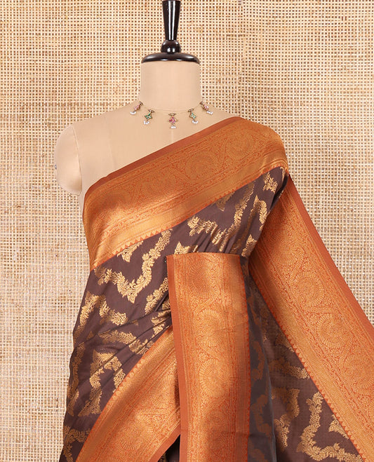 Brown Kanchi Silk Saree Richly Detailed with Floral Jacquard Design All Over Its Body, Complemented by a Contrast Traditional Zari Border of Floral Creeper Designs, an Opulently Embellished Pallu, and Paired with a Contrast Jacquard Blouse