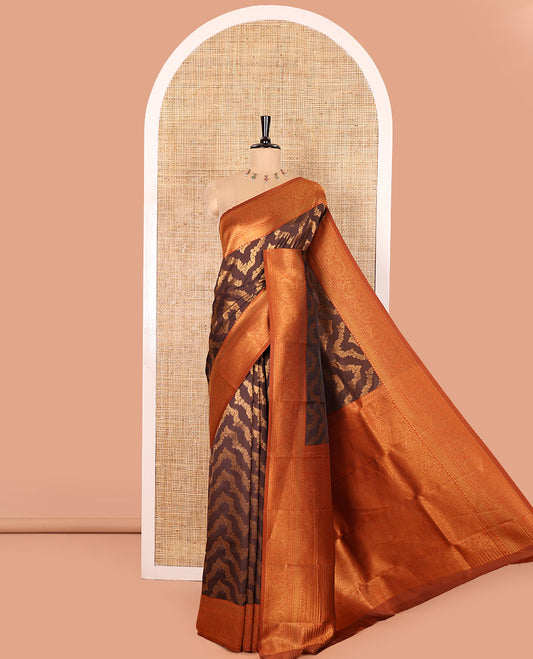 Brown Kanchi Silk Saree Richly Detailed with Floral Jacquard Design All Over Its Body, Complemented by a Contrast Traditional Zari Border of Floral Creeper Designs, an Opulently Embellished Pallu, and Paired with a Contrast Jacquard Blouse