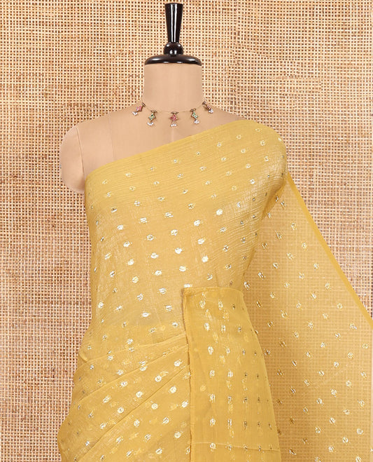 Borderless Mustard Shimmer Saree, Enriched with Zari Buttas All Over Its Body, Pallu Mirrors the Same Buttas, and Comes Without a Blouse