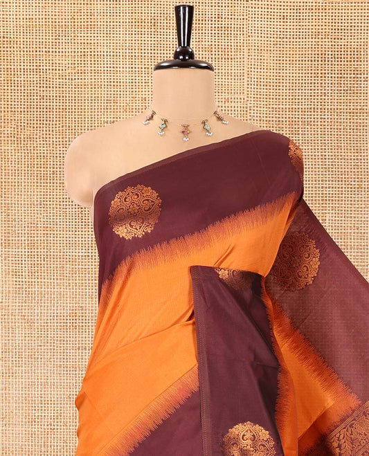 Rust Orange Kanchi Soft Silk Saree, Subtly Sparkled with Zari Buttas All Over Its Body,  Complemented by a Contrast Chakram Motifs Border, an Intricately Designed Pallu, and Paired with a Contrast Blouse