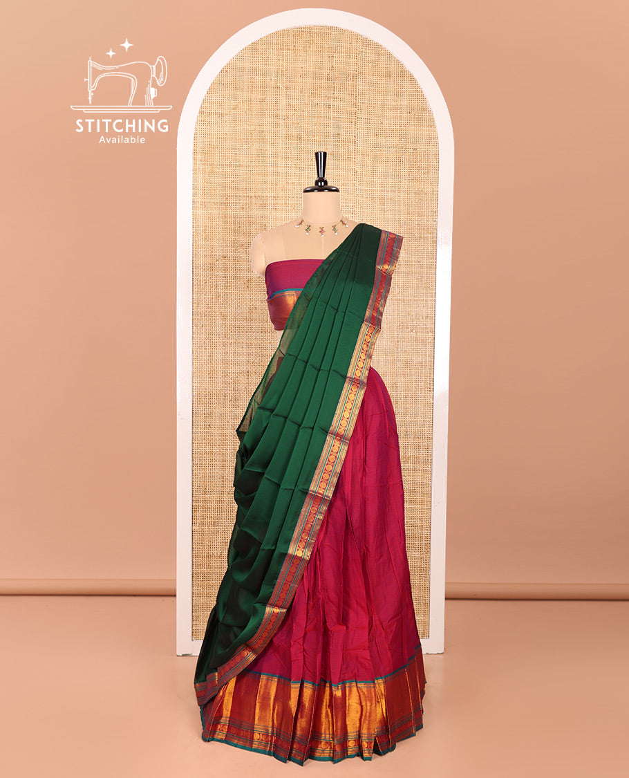 Magenta and Green Mercerised Cotton Half-Saree Featuring Plain Skirt, Adorned with a Contrast Peacock Eye-Rudraksham Motifs Woven Zari Border, Paired with a Matching Blouse, and Contrast Syska Georgette Dhavani with Zari Border