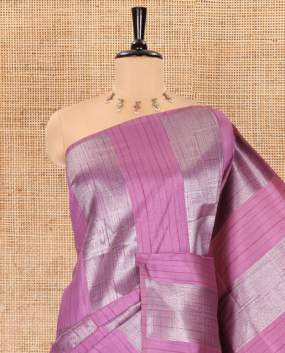 Borderless, pink striped, and zari traditional kanchi motifs fancy tussar saree, intricately zari-woven pallu, and a matching zari buttas woven blouse