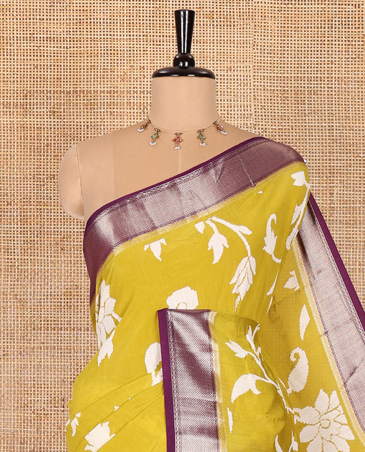 Gold floral and paisley vine ikkat-style discharge printed assam silk saree, contrast chevron design zari border, zari stripes, and a contrast zari bordered blouse