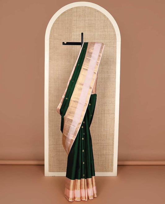 Green zari buttas Vasundhara silk mix saree, contrast rettai pettu border of rekku, kathir, round yaali, and zari designs, and vanki design pallu