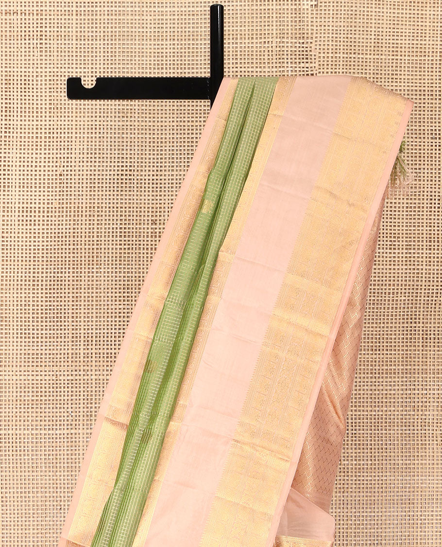 Green Vasundhara Silk Saree, Steeped in Richness with Mayil Chakram Buttas and Checked Design, Complemented by a Contrast Rettai Pettu Border of Iruthalai Pakshi, Banaras, Muthu, and Kodi Visiry Designs, Grand Jaal Pallu, and Paired with a Contrast Blouse