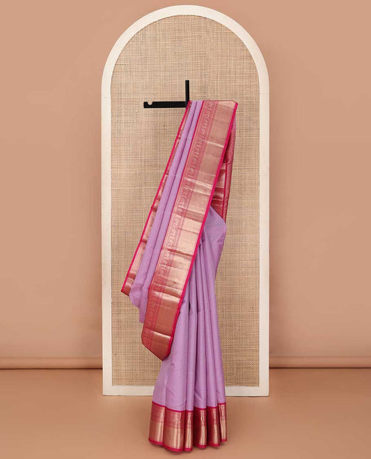 Pink zari striped silk saree, contrast border of salngai, cross kamalam, neli, and mayil designs and jaal pallu