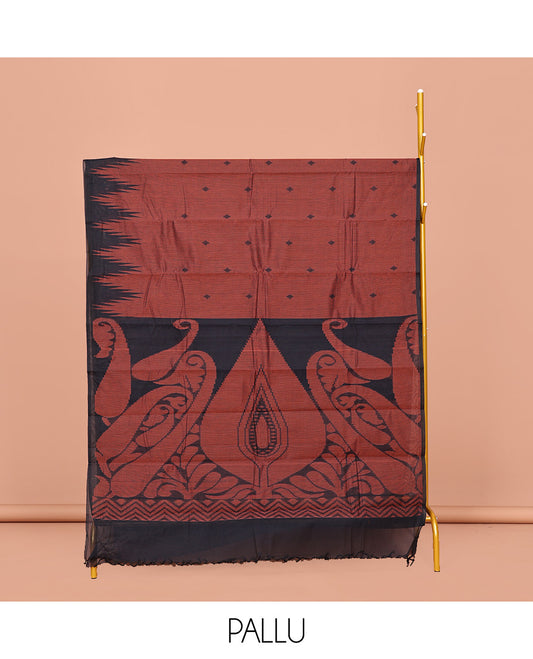 Rust Kanchi Cotton Saree, Enriched with Buttas on Its Body, Complemented by a Contrast Temple Border, a Pallu of Intricate Designs, and Paired with a Contrast  Blouse