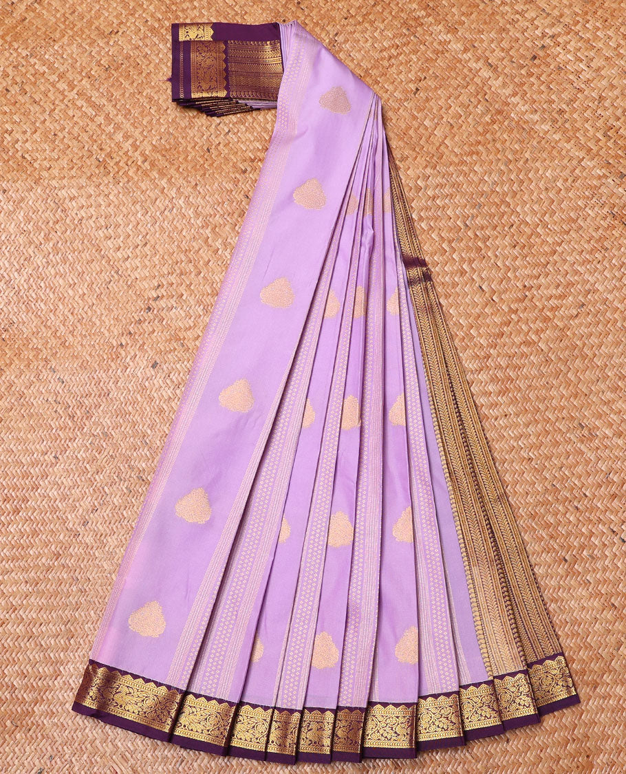 Lavender Budget Silk Saree, Majestically Detailed with Zari Buttas on Its Body, Complemented by a Traditional Zari Border of Peacocks, Geometric Textured Pallu, and Paired with a Contrast Blouse