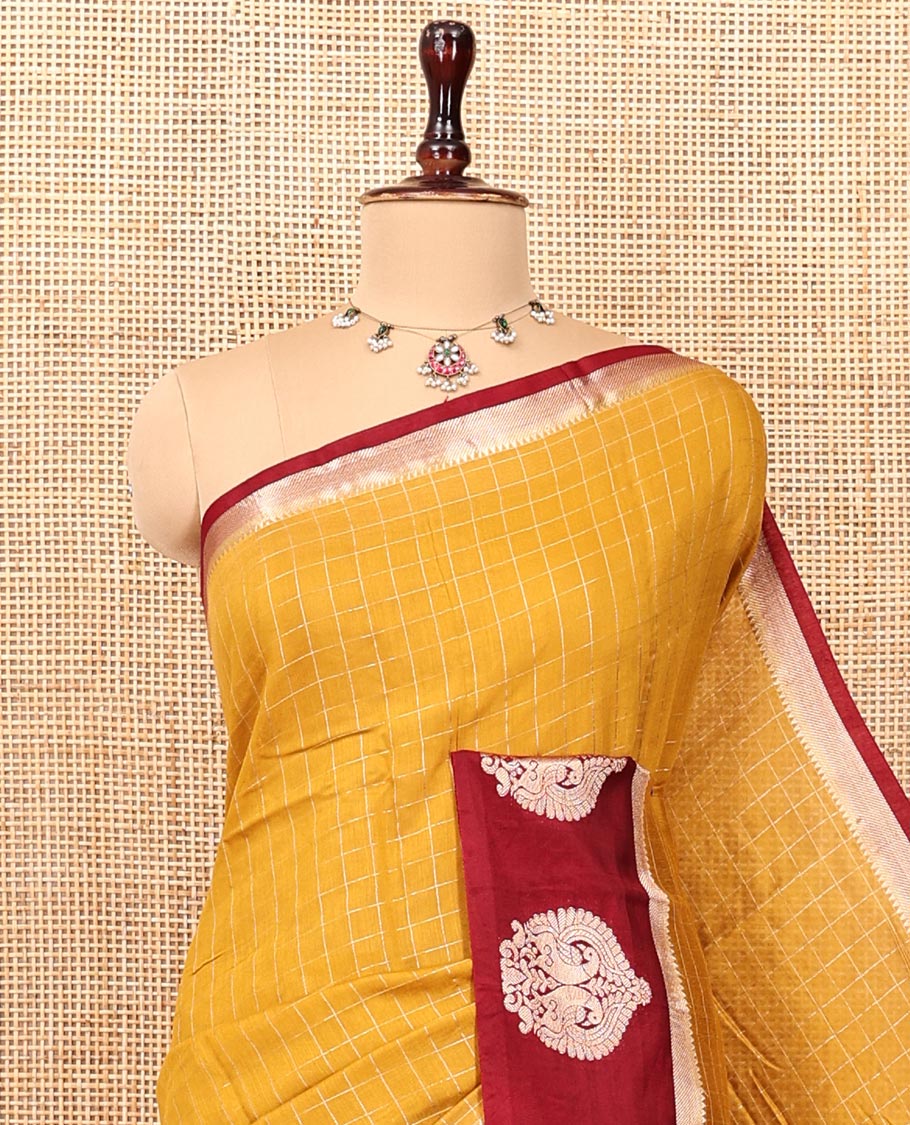 Mustard Assam Silk Saree, Decked Up with Checks, Complemented by Contrast Peacock Design Border, Zari-Striped Pallu, and a Contrast Blouse