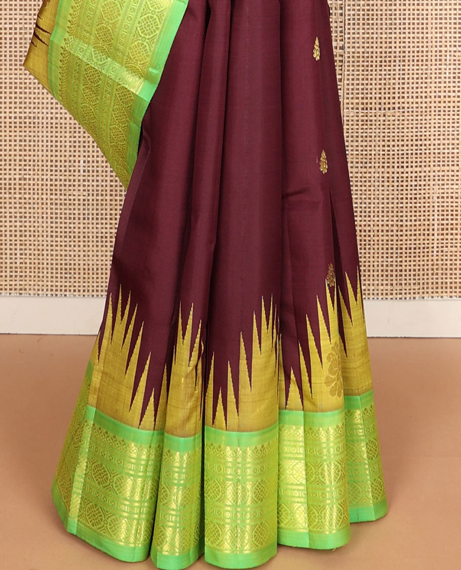 Maroon buttas Kanchipuram silksaree, contrast one-sided temple border of salngai,banaras,cross kamalam & laddu kamalam & floral pallu