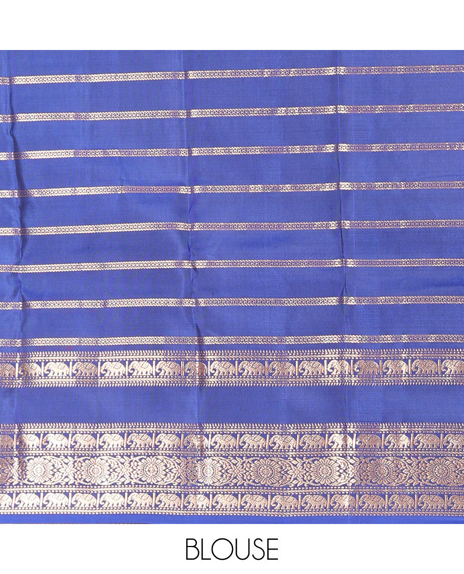 Blue Vasundhara Silk Saree Adorned with Zari Stripes and Annam Chakram Buttas, Highlighted by a Zari Border of Ara Bogudi, Muthu, Banaras, Yaanai, and Chakram Designs, a Zari-Woven Pallu of Jaal Designs, and Paired with a Matching Blouse