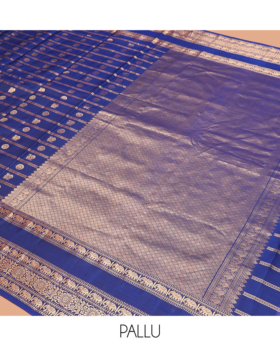 Blue Vasundhara Silk Saree Adorned with Zari Stripes and Annam Chakram Buttas, Highlighted by a Zari Border of Ara Bogudi, Muthu, Banaras, Yaanai, and Chakram Designs, a Zari-Woven Pallu of Jaal Designs, and Paired with a Matching Blouse