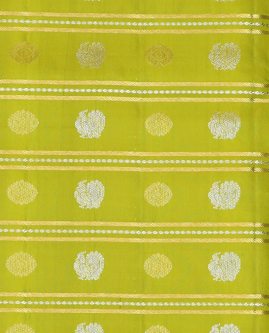Green pure silk half saree, mayil chakram buttas skirt, contrast blouse of border of thilakam, poun, mayil kann, and dhavana kodi, and arumbu manga design pallu