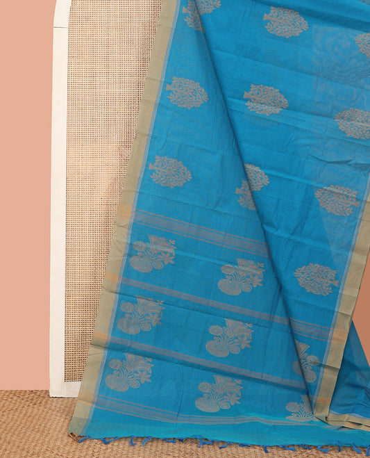 Blue Kanchi Cotton Saree, Bedecked with Tree Buttas All Over Its Body, Complemented by Contrast Border, Pallu Depicts Flower Vase Designs, and Paired with a Matching Blouse