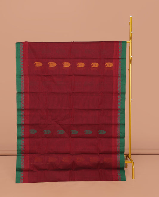 Red Kanchi Cotton Saree, Decorated with Buttas All Over Its Body, Complemented by a Contrast Border, Pallu of Floral and Paisley Designs, and Paired with a Matching Blouse