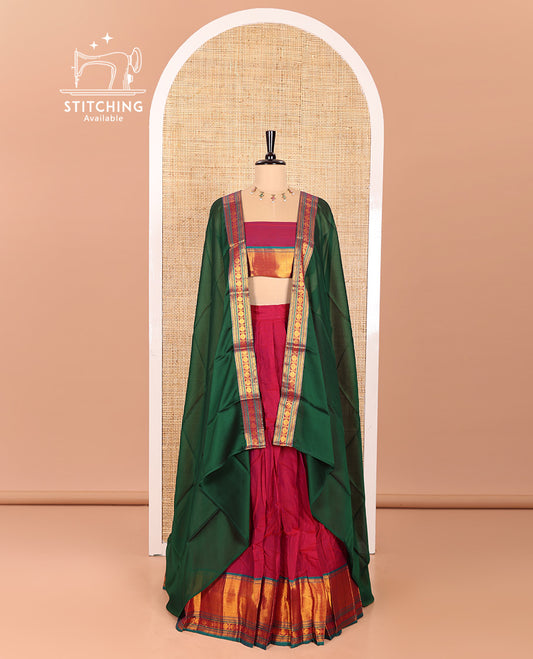 Magenta and Green Mercerised Cotton Half-Saree Featuring Plain Skirt, Adorned with a Contrast Peacock Eye-Rudraksham Motifs Woven Zari Border, Paired with a Matching Blouse, and Contrast Syska Georgette Dhavani with Zari Border