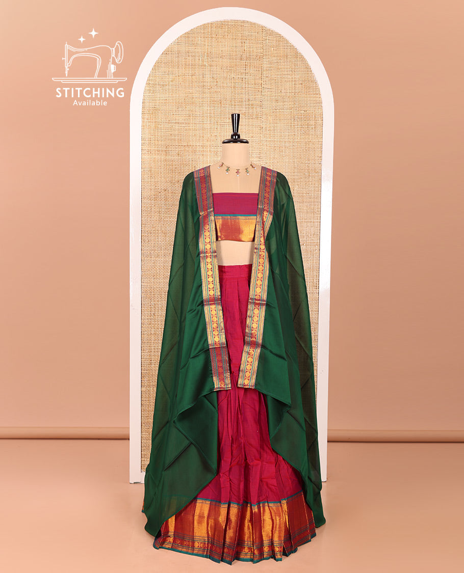 Magenta and Green Mercerised Cotton Half-Saree Featuring Plain Skirt, Adorned with a Contrast Peacock Eye-Rudraksham Motifs Woven Zari Border, Paired with a Matching Blouse, and Contrast Syska Georgette Dhavani with Zari Border