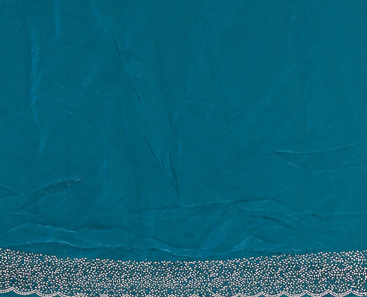 Rama blue Swarovski crystal stone embedded fendy chiffon saree, scallop Swarovski stone embroidered border, and contrast plain blouse