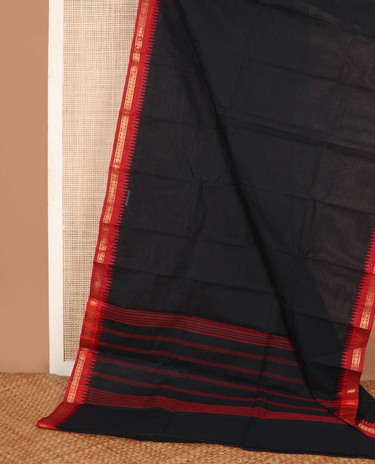Black plain Chettinad cotton saree, contrast temple border of diamond motifs & red thread striped pallu
