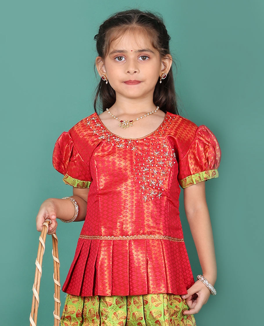 Green readymade art silk pavadai set, floral jacquard with contrast traditional zari border skirt, and contrast jacquard embroidered puff-sleeve blouse