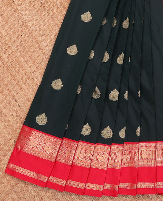 Black Budget Silk Saree, Gleamed Up with Zari Buttas, Complemented by a Contrast Traditional Rettai Pettu Border, Grand Pallu, and a Contrast Blouse