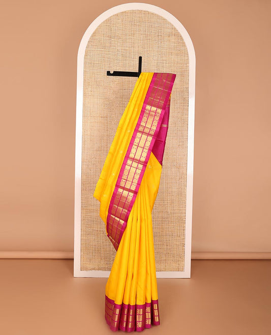 Yellow buttas kancheepuram silk saree with contrast korvai border of paun, banaras design & zari design pallu