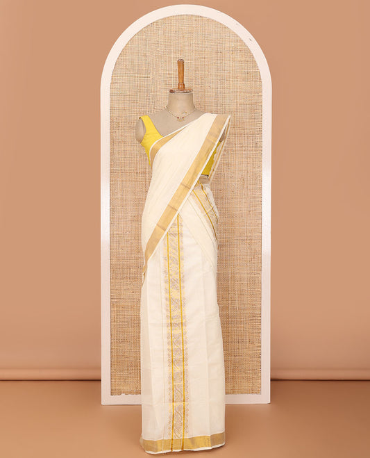 Cream plain Kerala mundu set with traditional golden zari woven border