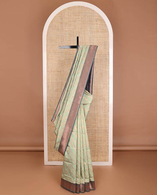 Sage green butter silk saree with floral zari designs, contrast traditional zari design & jaal pallu