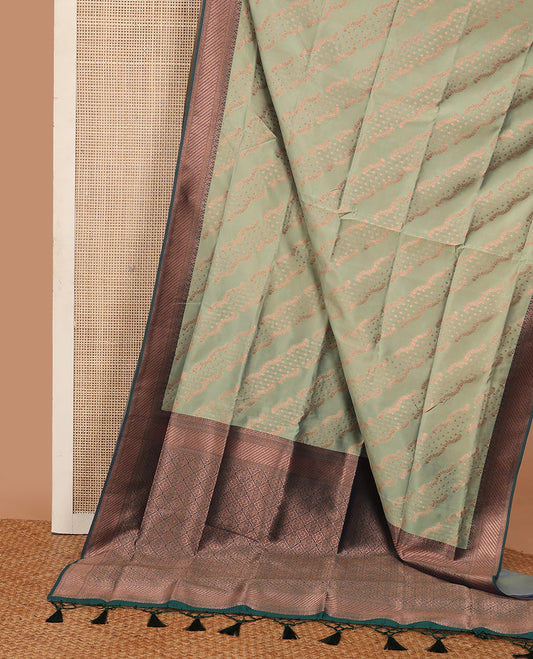 Sage green butter silk saree with floral zari designs, contrast traditional zari design & jaal pallu