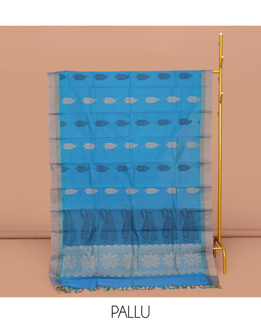 Blue Kanchi Cotton Saree, Accentuated with Buttas All Over Its Body, Complemented by a Contrast Border, Pallu of Floral and Paisley Designs, and Paired with a Matching Blouse