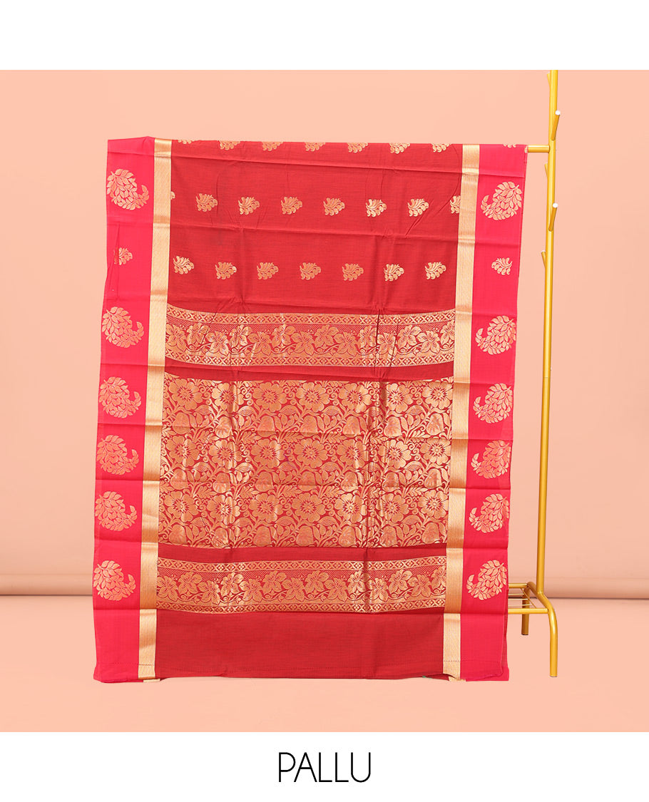 Red Semi-Silk Cotton Saree, Richly Detailed with Zari Buttas All Over Its Body, Complemented by a Contrast Paisley Zari Design Border, Pallu of Floral Design, and Paired with a Contrast Blouse