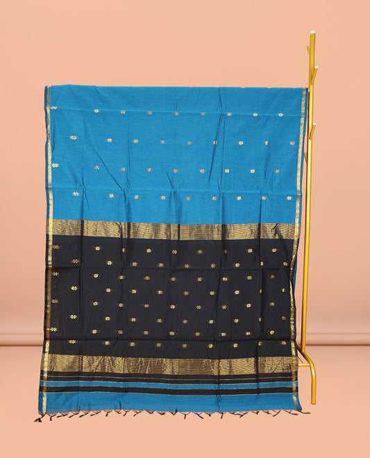 Blue Maheshwari Cotton Saree, Delicately Woven with Buttas All Over Its Body, Subtle Zari Piping Border, Complemented by a Contrast Pallu Steeped with Buttas, and Paired with a Contrast Blouse