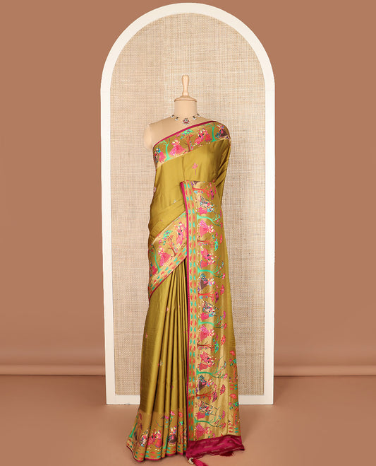 Green unique motifs printed dola silk saree, gleaming zari border, and pallu of Mughal-style man and women motifs