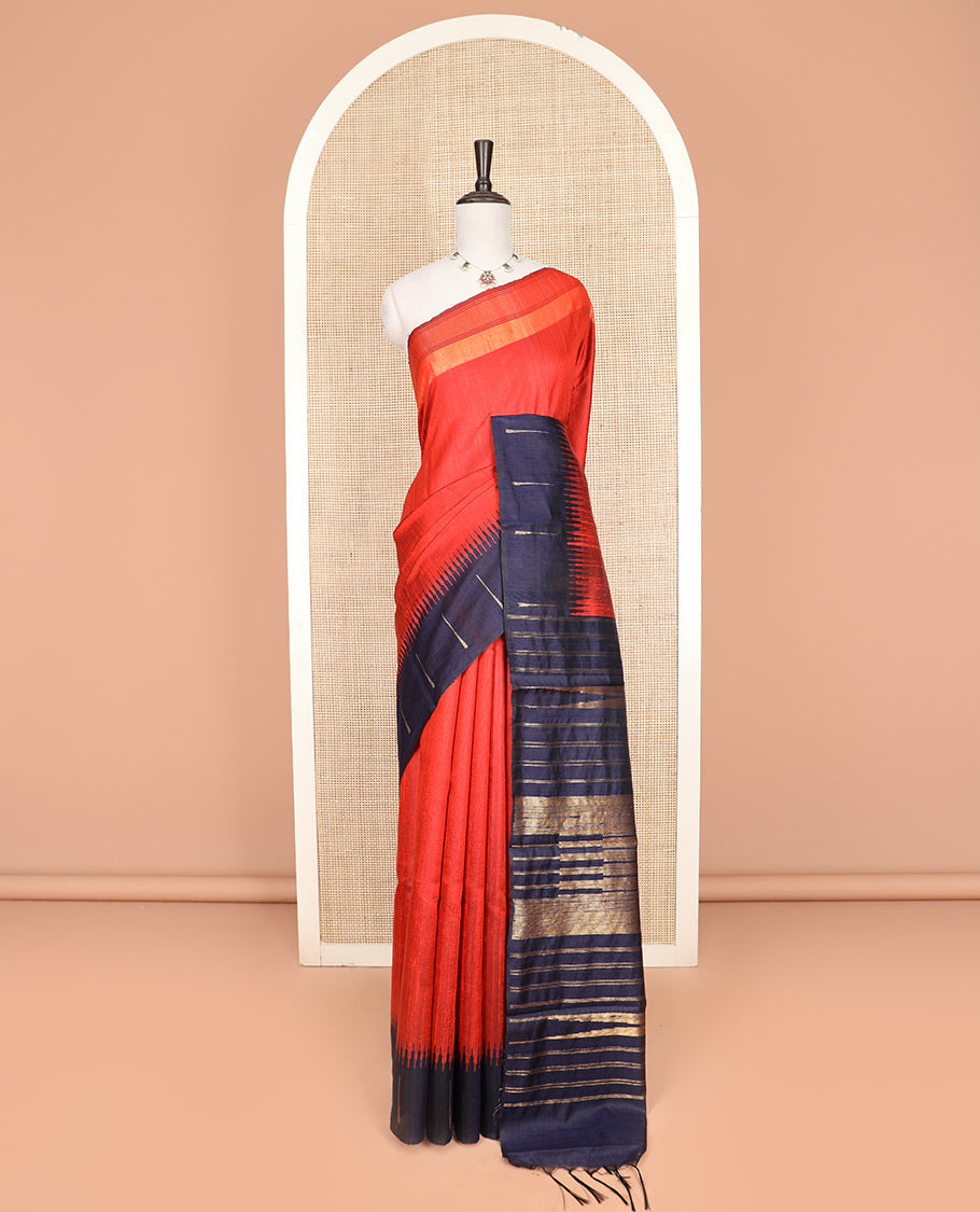 Orange Plain Dupion Silk Saree, Complemented by a One-Side Contrast Temple Border, Zari Elevated Pallu of Temple Designs, and Paired with a Contrast Blouse