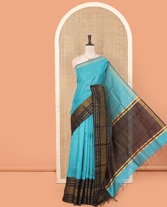 Blue butta enclosed checked dupion saree, contrast traditional zari border, and zari design pallu