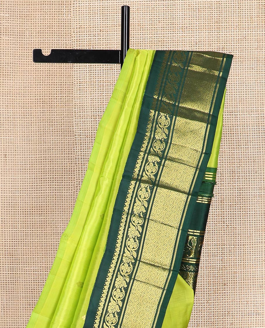 Green zari buttas kanchipuram silk saree, contrast one-sided korvai border of salngai, kodi visiry & jaal & anicient human motifs woven pallu