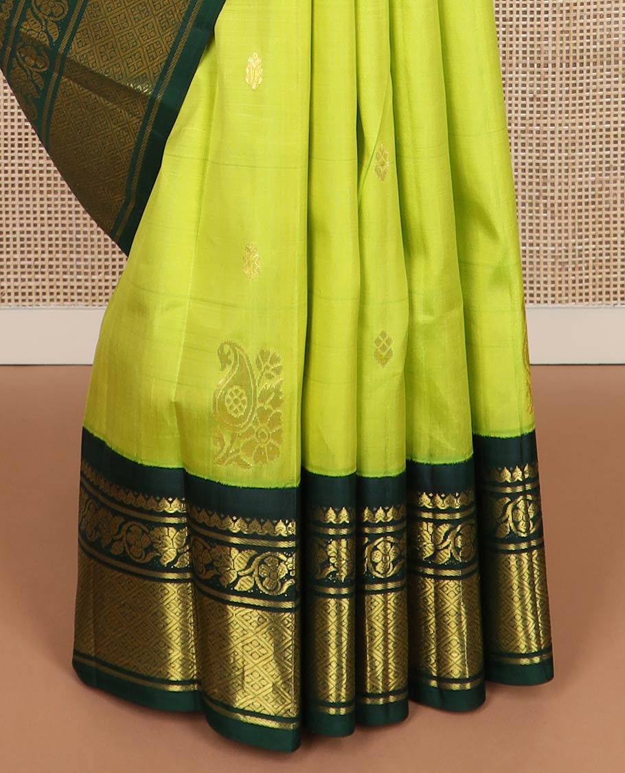 Green zari buttas kanchipuram silk saree, contrast one-sided korvai border of salngai, kodi visiry & jaal & anicient human motifs woven pallu