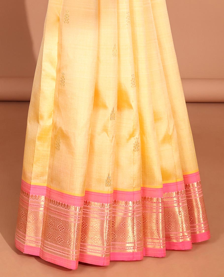 Yellow floral buttas kancheepuram silk saree with contrast border of sombu,banaras, muthu, jaal design & zari design pallu
