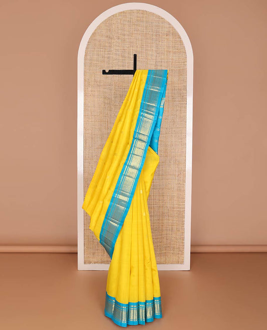Yellow kancheepuram silk saree with zari buttas, contrast one-sided korvai border of thilakam mokku, banaras & jaal design & pallu of zari designs