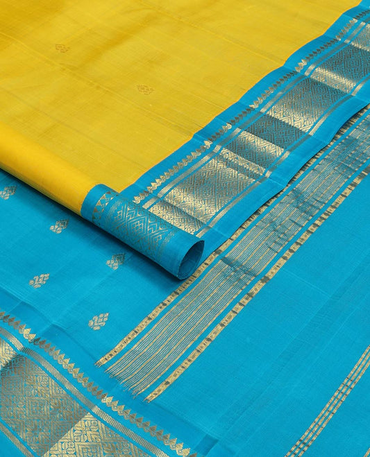 Yellow kancheepuram silk saree with zari buttas, contrast one-sided korvai border of thilakam mokku, banaras & jaal design & pallu of zari designs