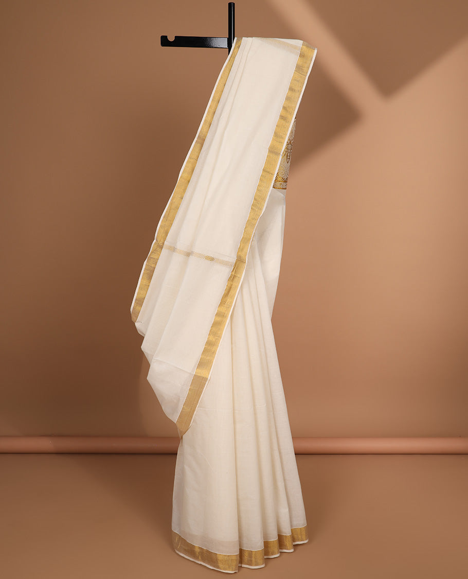 Cream kerala saree with zari design, plain border & pallu of intricate designs
