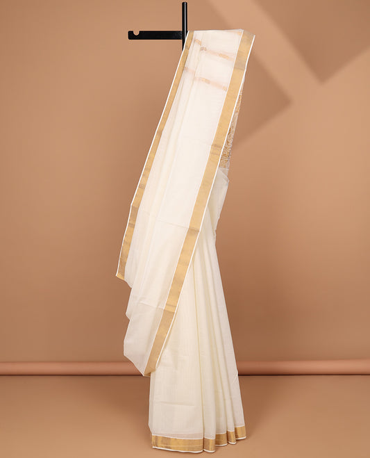 Cream kerala saree with zari stripes, zari border & pallu of intricate designs