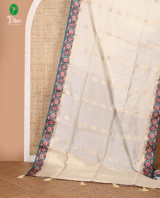 Cream zari buttas viscose georgette saree, contrast zari & ajrakh print border,zari-rich pallu & ajrakh printed blouse