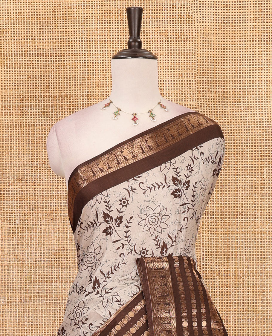 Brown floral printed dola silk saree,  contrast traditional zari rettai pettu border, pallu of paisley-floral print & contrast blouse of print & zari border