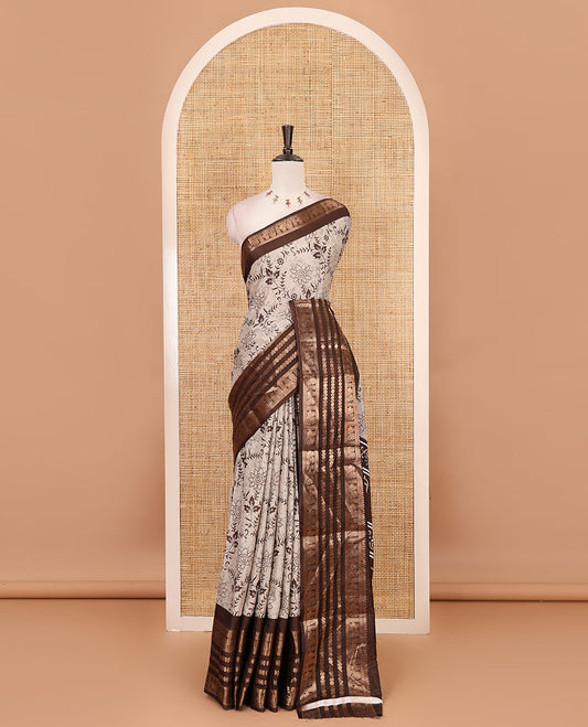 Brown floral printed dola silk saree,  contrast traditional zari rettai pettu border, pallu of paisley-floral print & contrast blouse of print & zari border