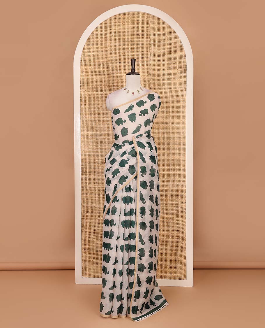 Borderless cream-green elephant motifs printed linen cotton saree, matching elephant motifs printed blouse