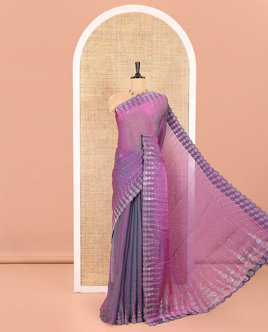 Violet Fendi Chiffon Saree Gleamed up With Glittering Swarovski Stones Struck All Over Its Body, Complemented With Scallop Swarovski Stone Work Border, Swarovski Stone Work Pallu, And A Matching Swarovski Stone Work Blouse