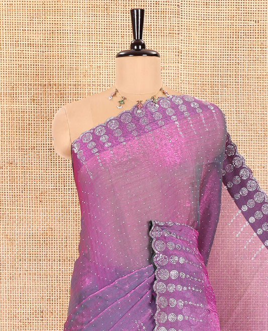 Violet Fendi Chiffon Saree Gleamed up With Glittering Swarovski Stones Struck All Over Its Body, Complemented With Scallop Swarovski Stone Work Border, Swarovski Stone Work Pallu, And A Matching Swarovski Stone Work Blouse