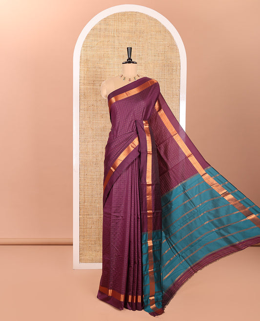 Purple Semi-Soft Silk Saree Enthralled  with Plus-Shaped Buttas All Over the Body, Highlighted with Zari Border, Complemented by Contrast Pallu of Zari Stripes, and Paired with a Contrast Blouse